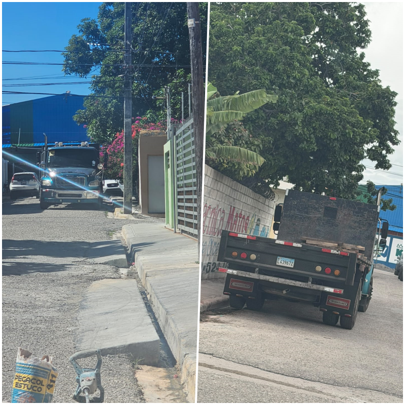 Camiones estacionados en una vía del sector Naco, en Barahona, que residentes señalan como un obstáculo para el tránsito.
